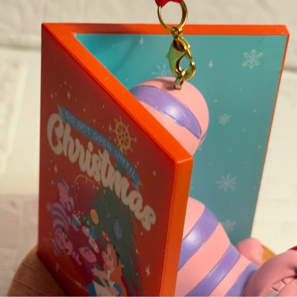 New Disney Cheshire Cat Christmas Ornament in Book Red and Purple